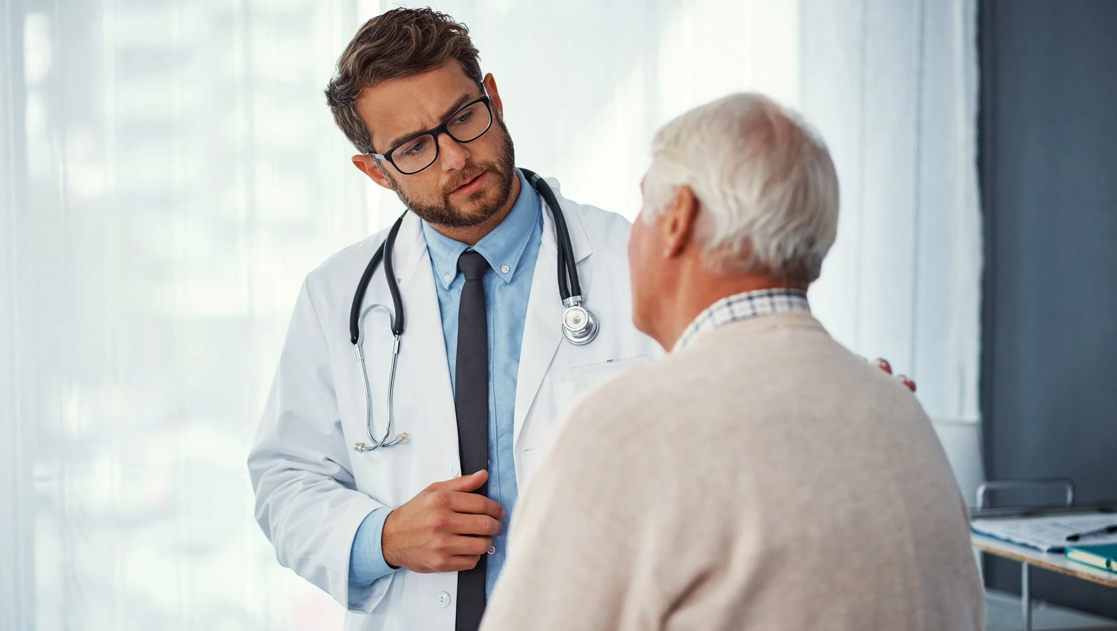 A Veteran talking with his VA doctor