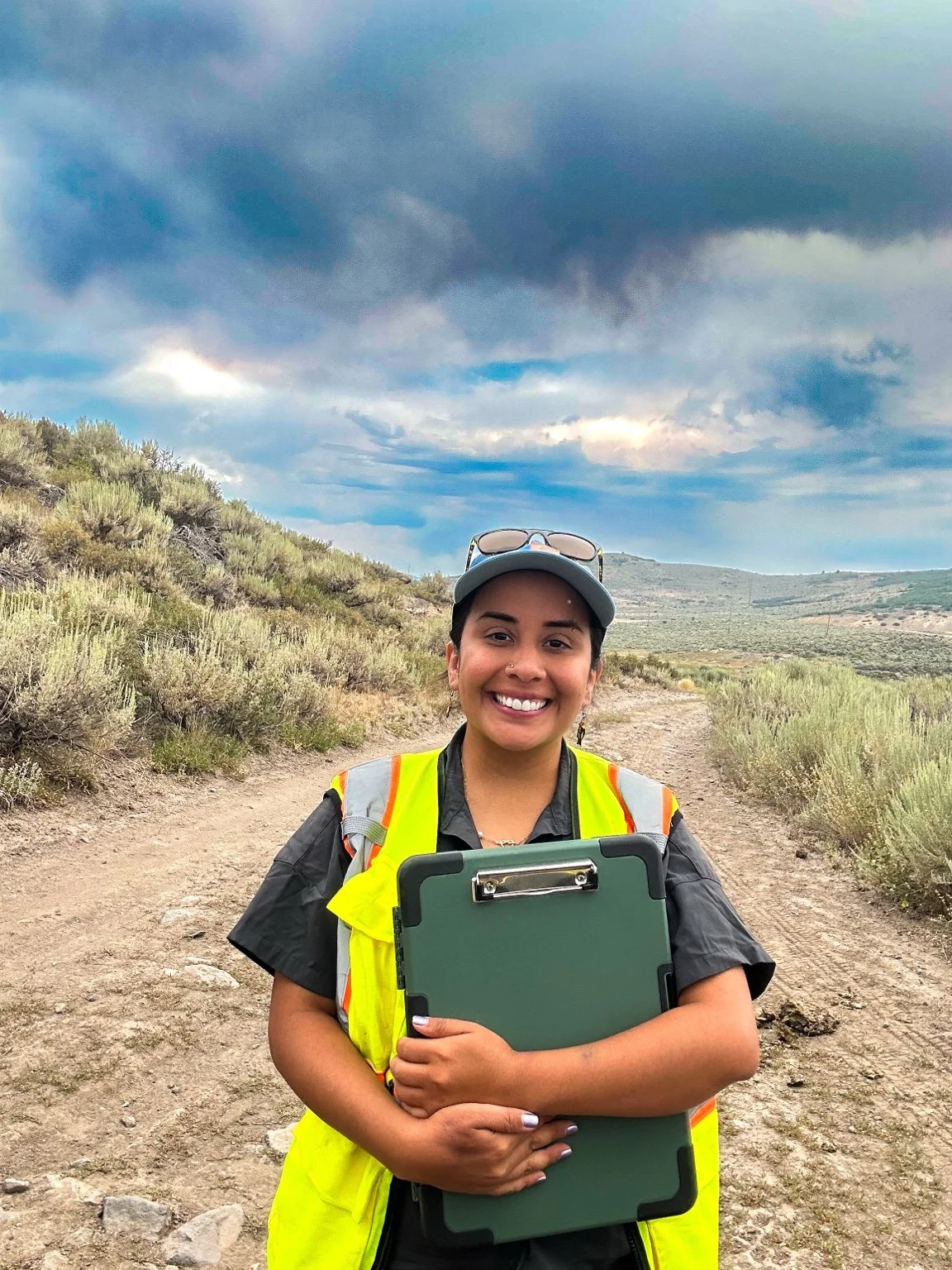 Helani in the field with her clipboard