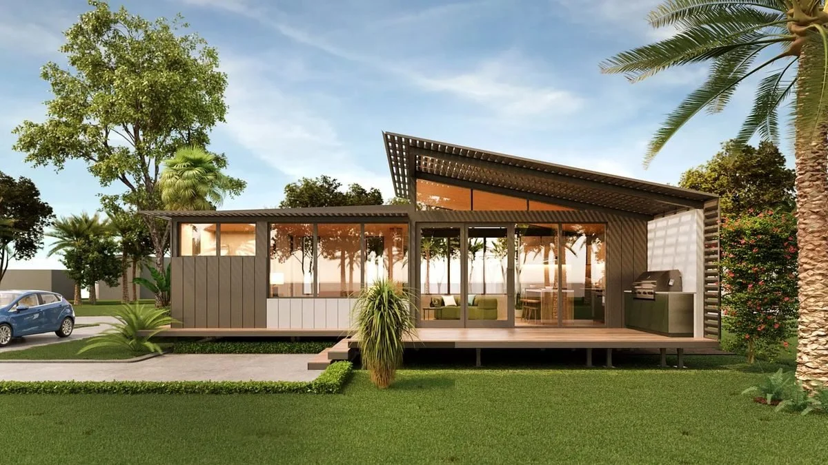 Indicative Freedom 55 exterior (Greater Homes Balance 55 imagery): skillion roof, timber-lined glazed living area and a generous side deck in a landscaped garden.