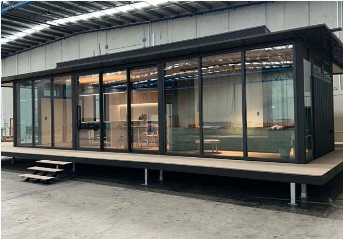 Freedom module on the factory floor at Greater Homes: finished unit on stilts inside the warehouse.