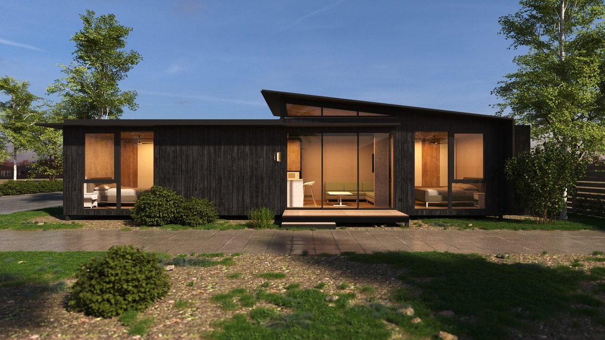 Freedom 60 exterior: dark vertical cladding, skillion roof and glazed living room opening to a timber deck.
