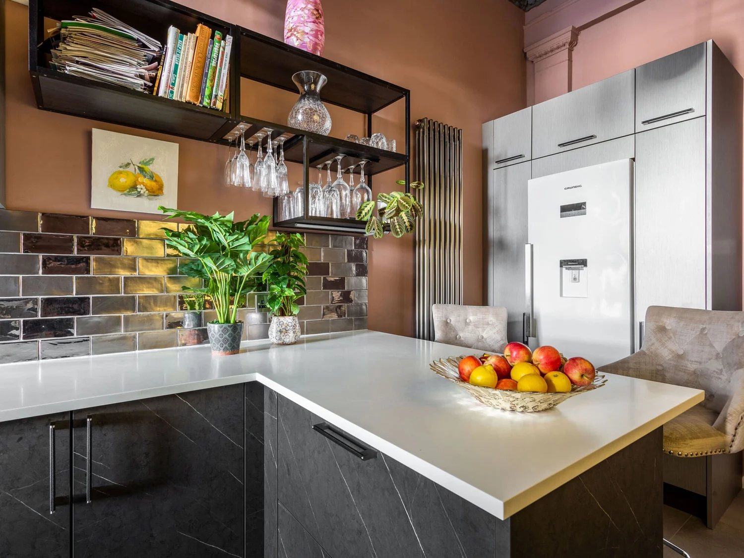White Minerva solid-surface worktop, dark cabinetry and open shelving at Bristol Mansions