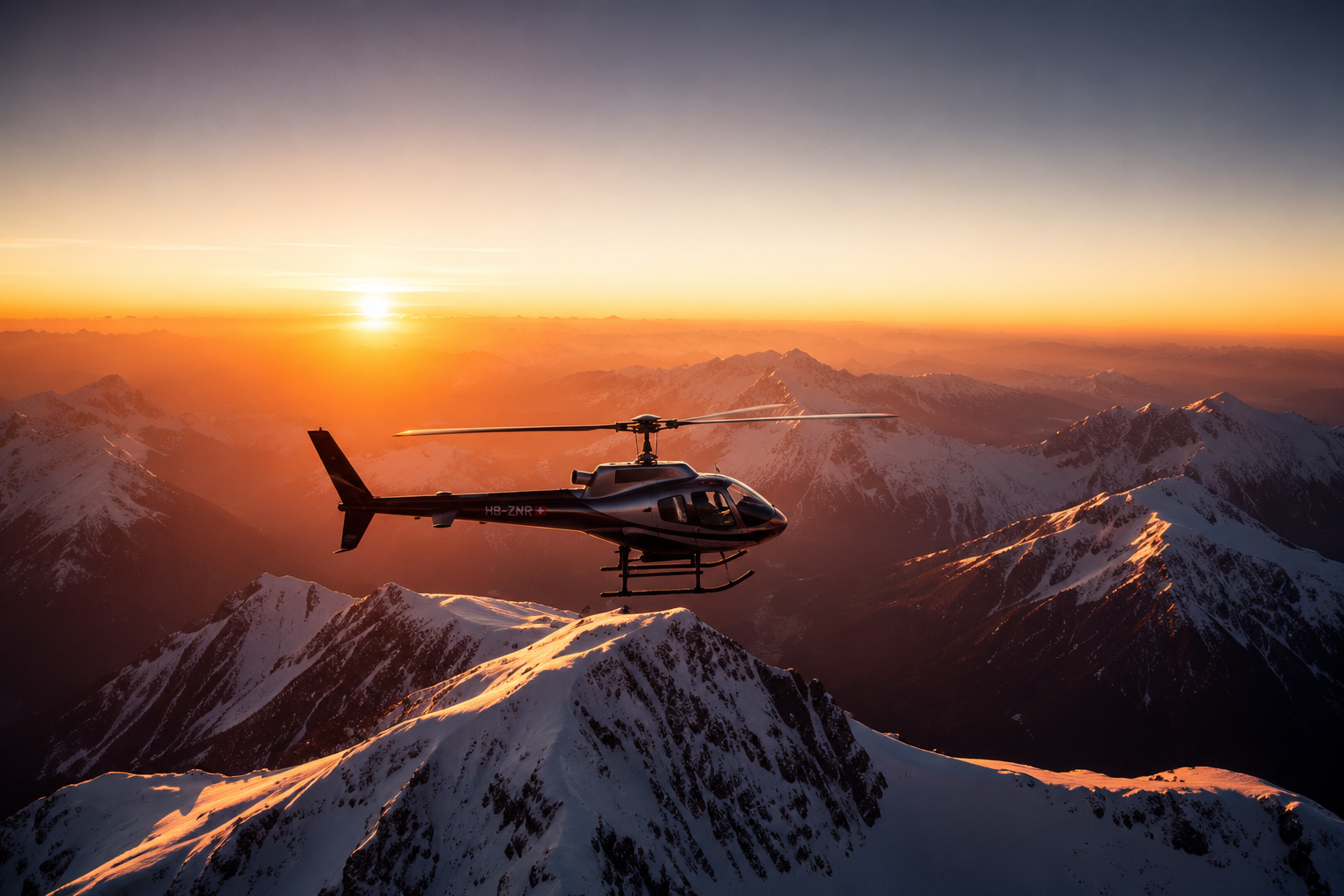 Private helicopter flying over snowy mountains at sunrise