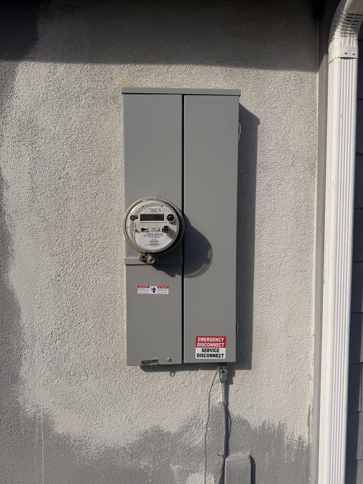 Exterior electrical meter and service panel installed by Silverback Electric