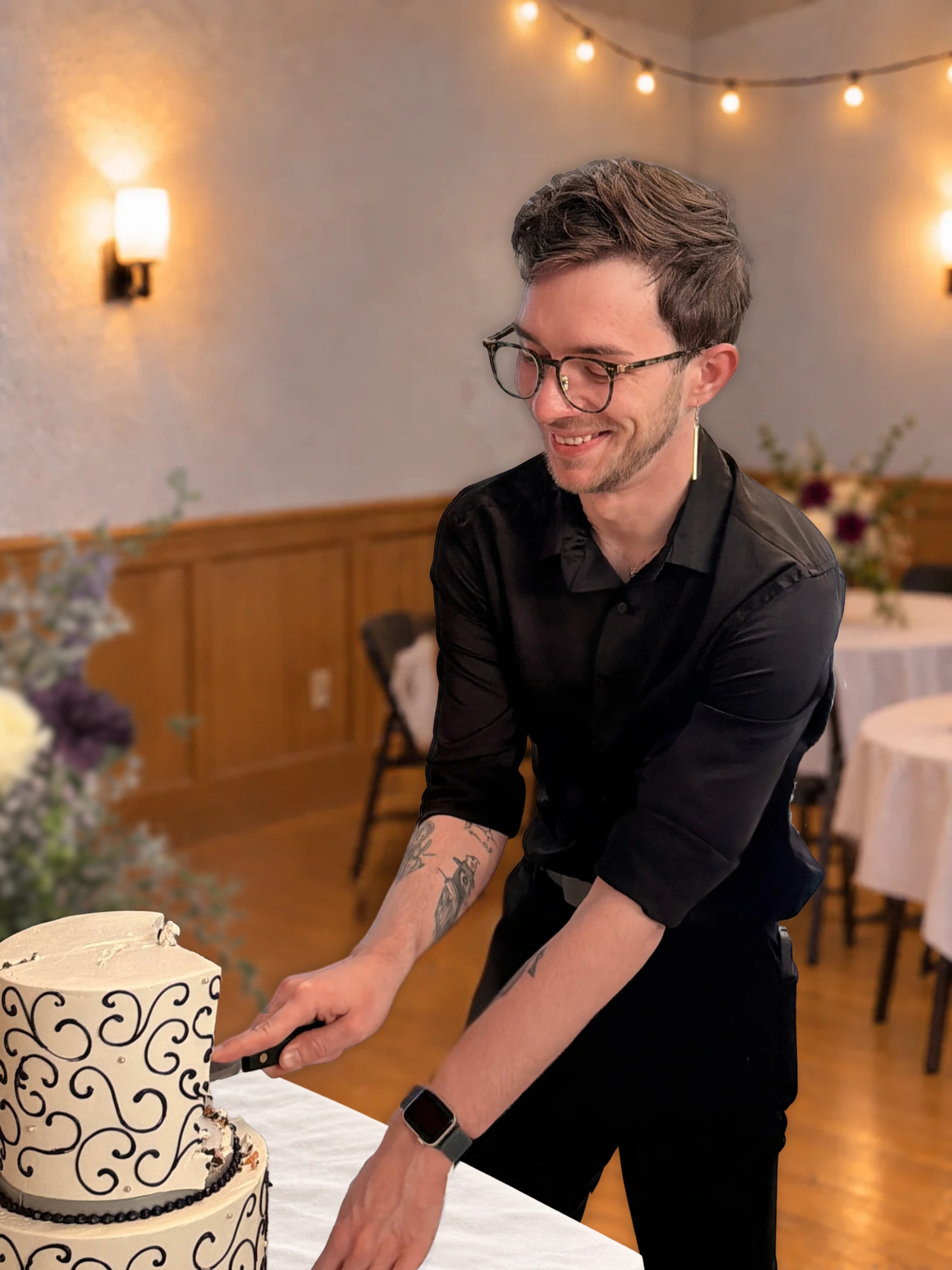 TJ cutting a cake at a celebration