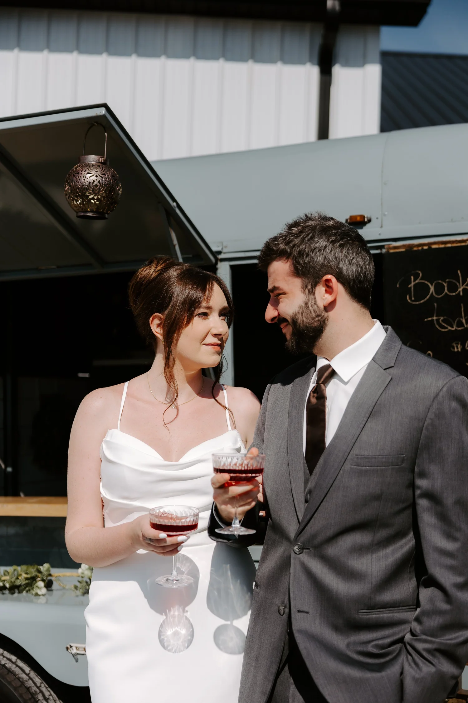 A bride and groom sharing a toast together