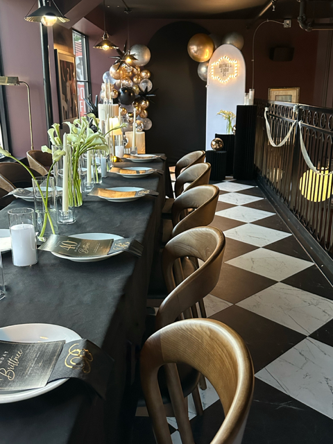 Long dinner tables set for a 40th birthday celebration
