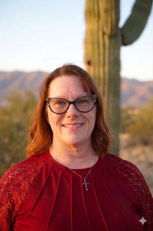 Amy Manuele, LCSW — trauma and couples therapist in Wickenburg, Arizona, photographed at golden hour with the desert mountains behind her