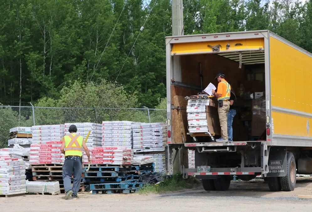 Lumber One general delivery truck loading materials