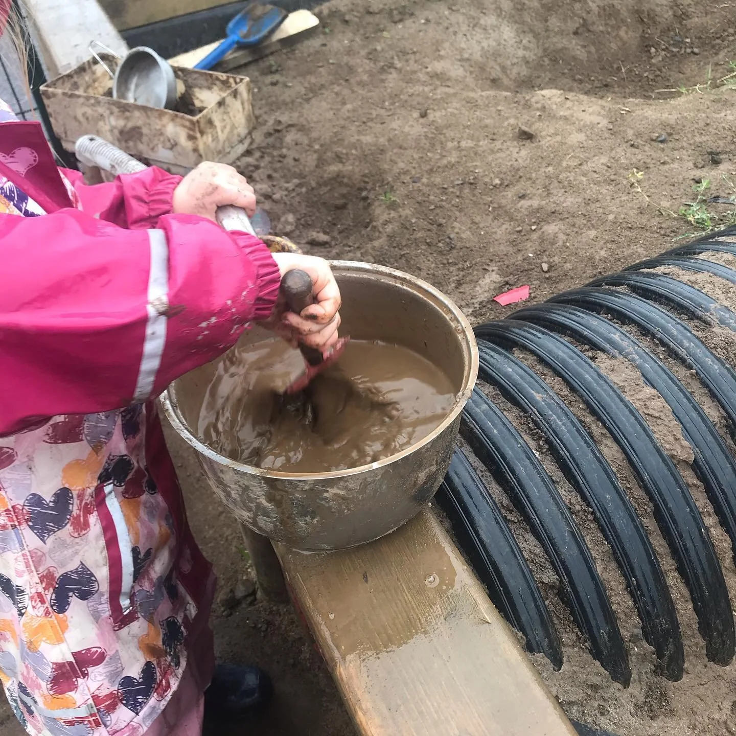 Child at the mud kitchen