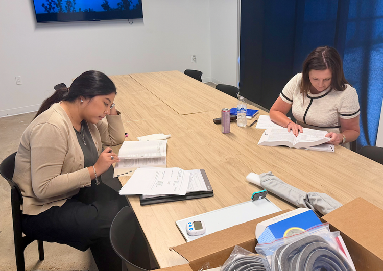 AFTA law clerks Yennisse Sevilla and Sheena Watson researching