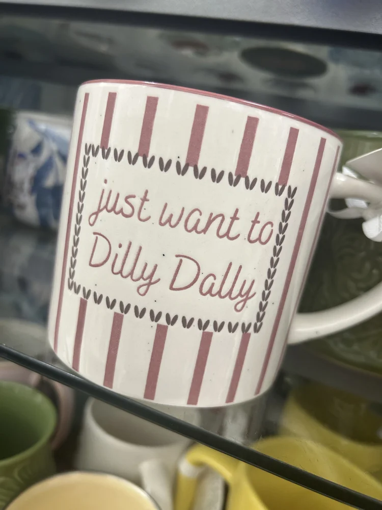 A mug reading just want to dilly dally, from a paralegal's surprise afternoon off