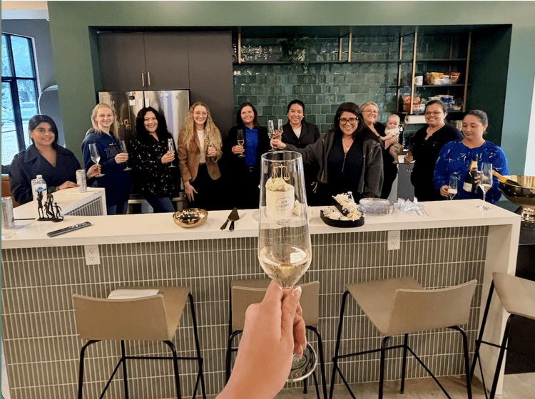 The team raises a toast at a send-off celebration