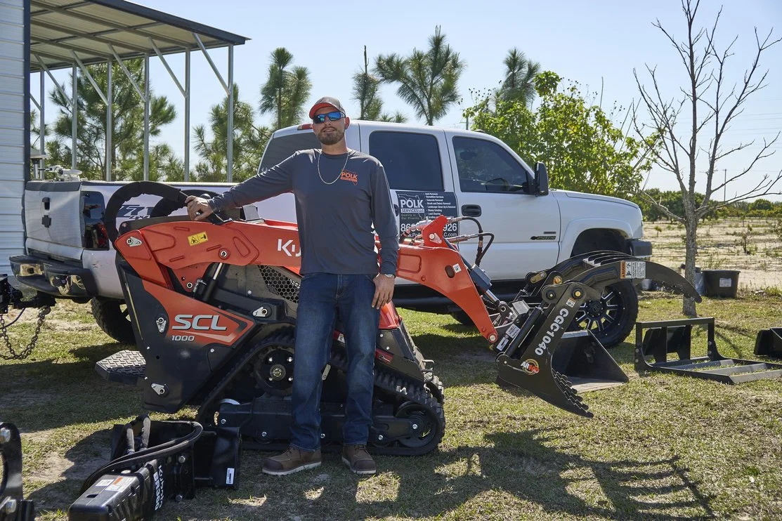 Donny Gozzola, owner of Polk Services LLC, with his branded truck and Kubota mini skid steer in Lakeland, FL.