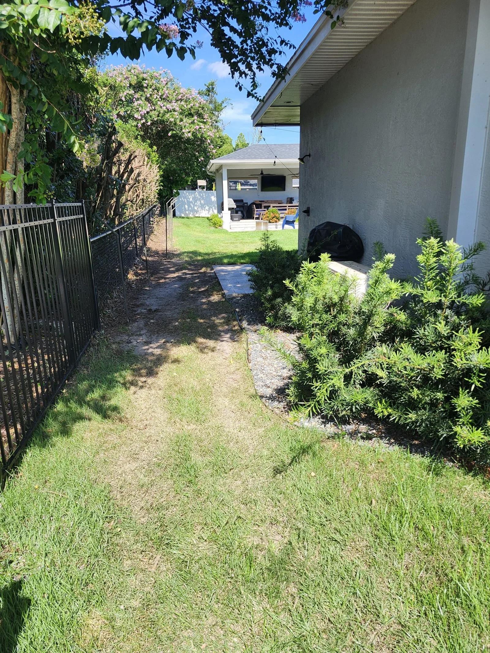 Polk Services yard cleanup in Lakeland, FL — overgrown lot cleared and reset.
