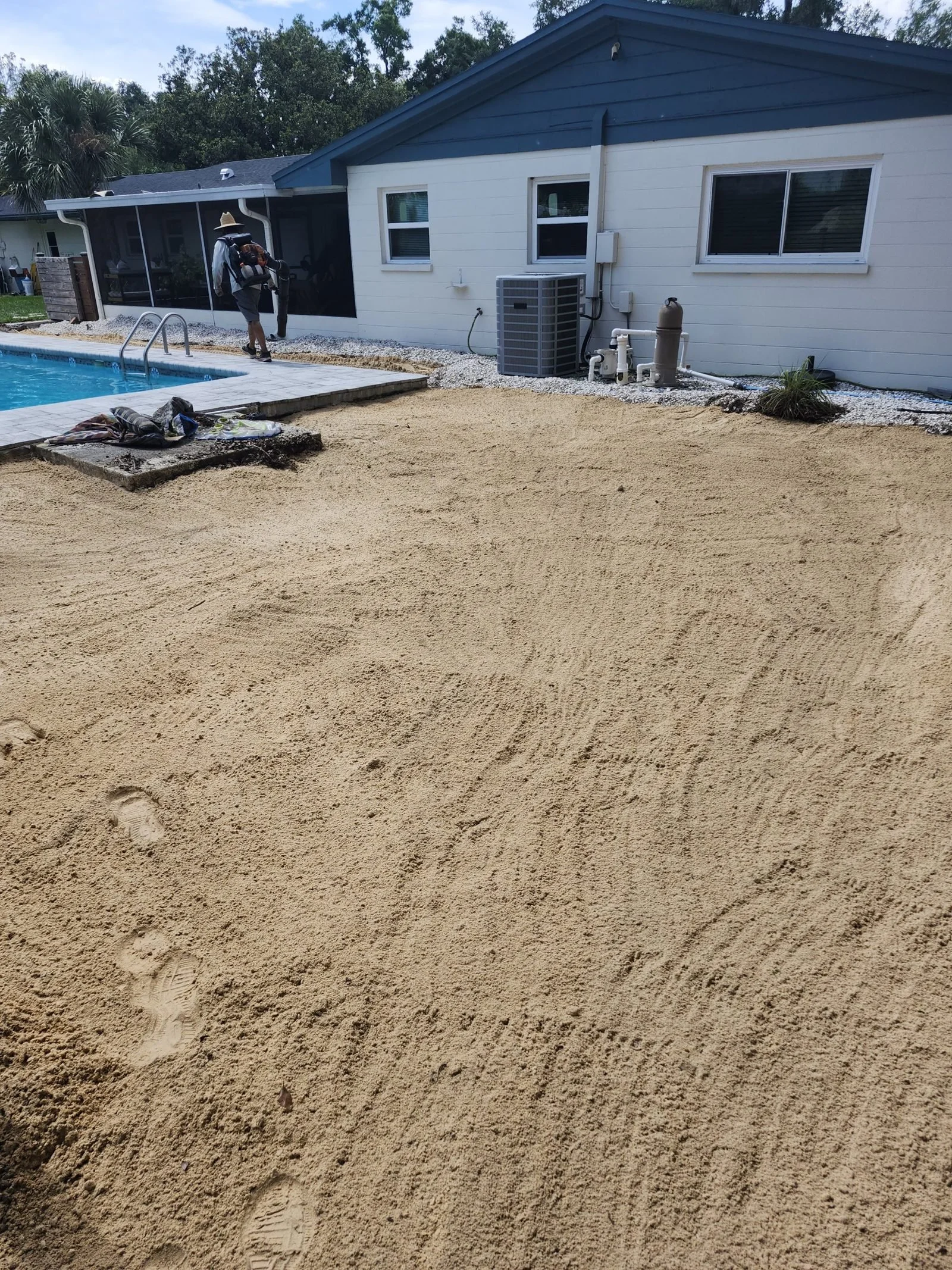 Graded dirt where the old wood deck stood, after Polk Services deck removal.