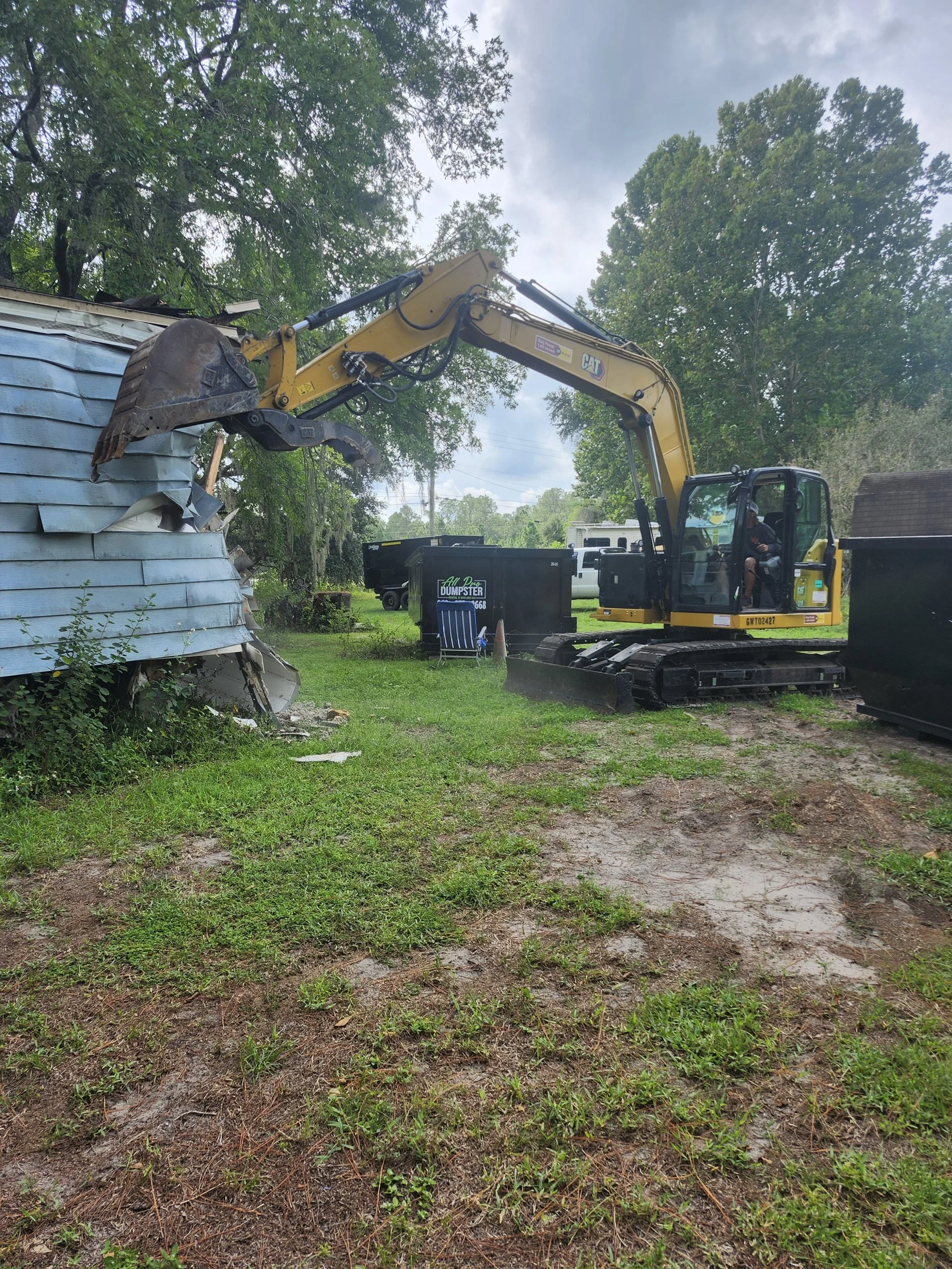 Donny Gozzola operating the Polk Services Kubota SCL1000 mini skid steer on a live Lakeland, FL job site.