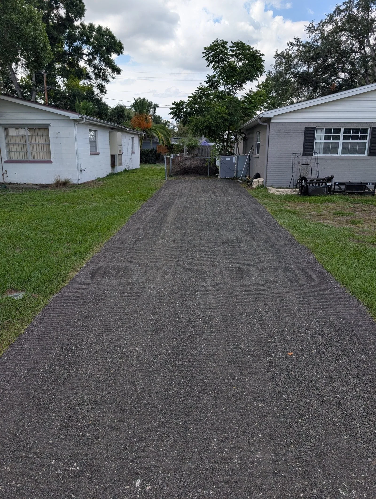 Finished Polk Services crushed-asphalt driveway.