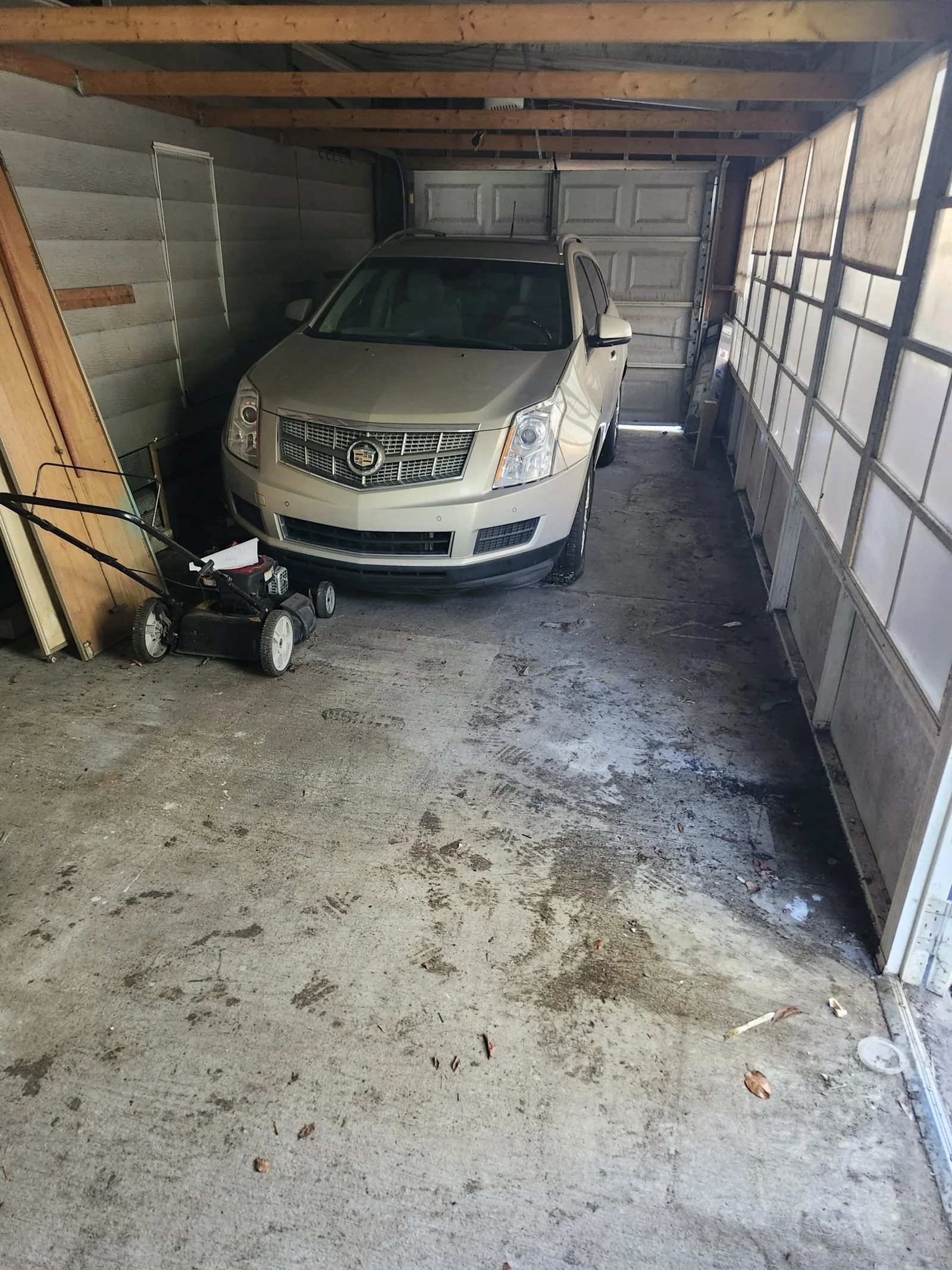 Garage floor cleared and usable again after a Polk Services cleanout.