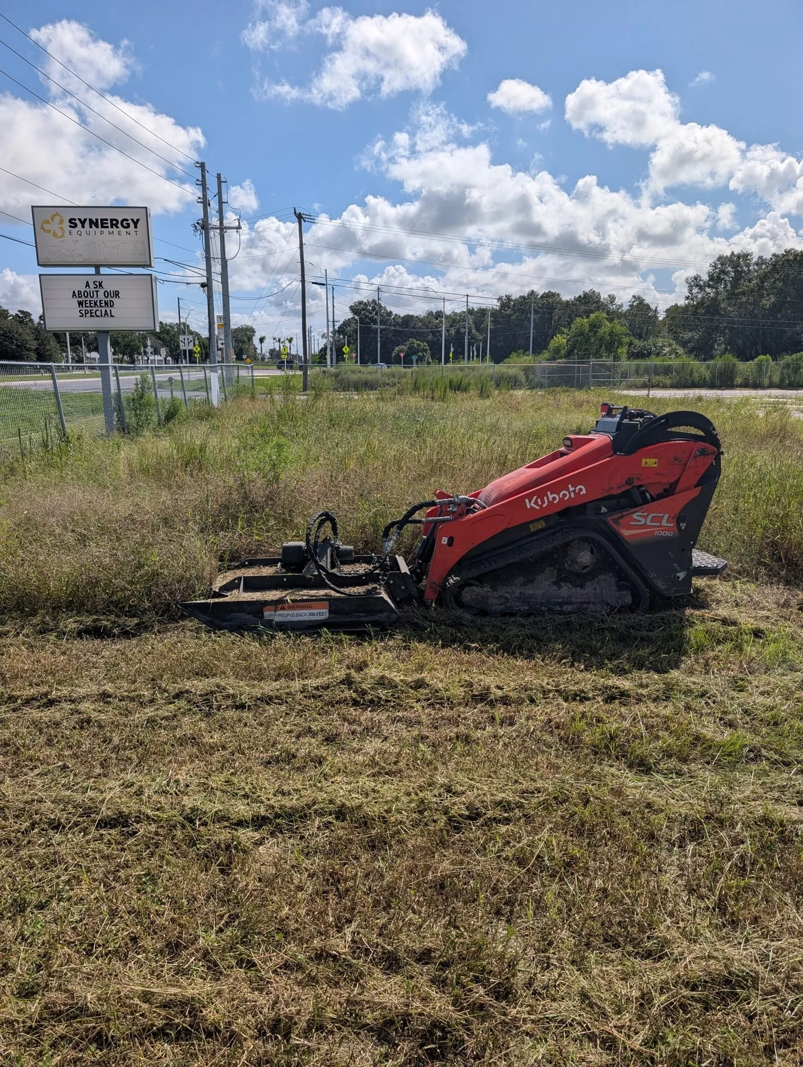 Donny Gozzola, owner of Polk Services LLC, with his branded truck and Kubota mini skid steer in Lakeland, FL.