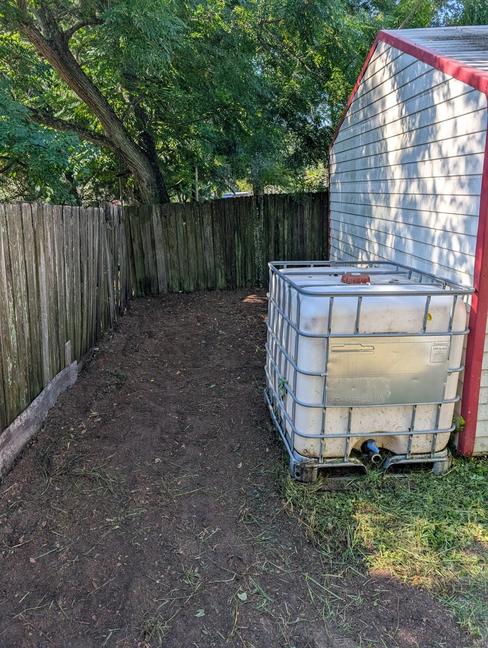 Polk Services construction-site cleanup after, cleared and raked clean.
