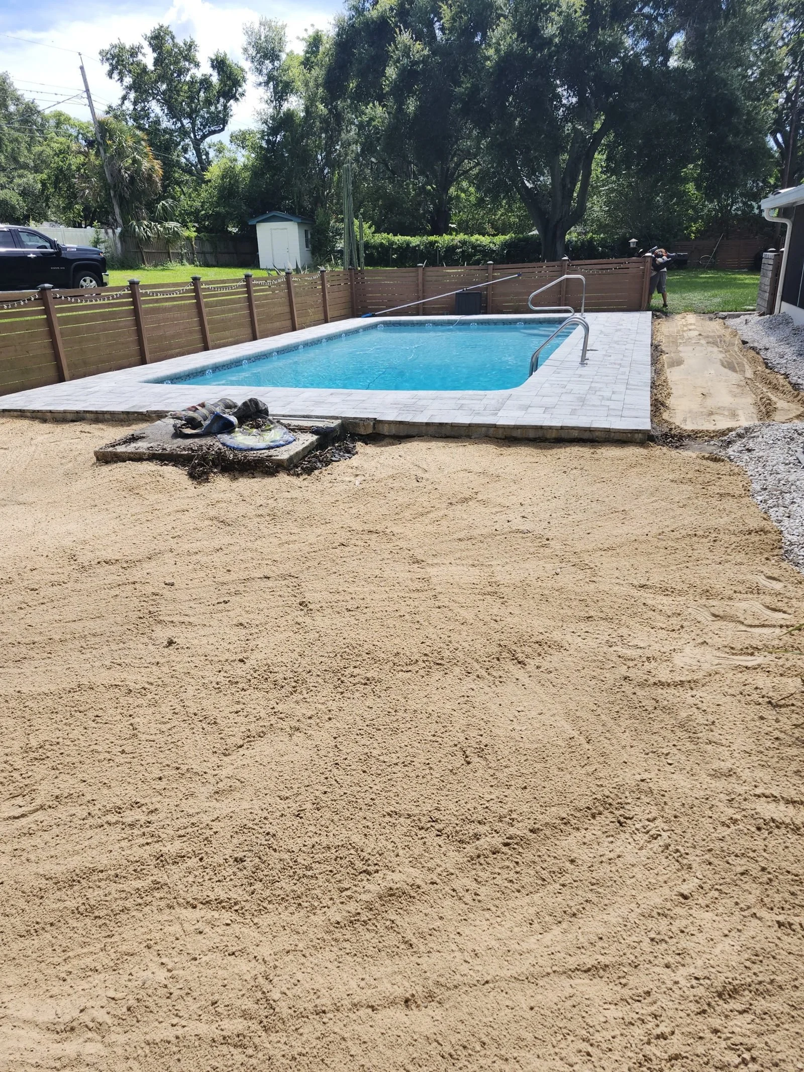 Polk Services pool demolition in Lakeland, FL — in-ground concrete pool full removal with deck and fill.