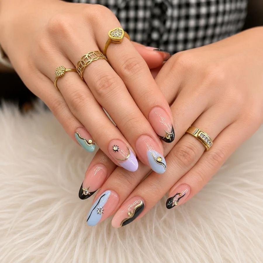 Detailed nail art with gold rings
