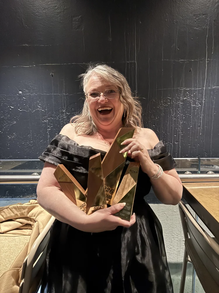 Susan with her ROAR award trophies