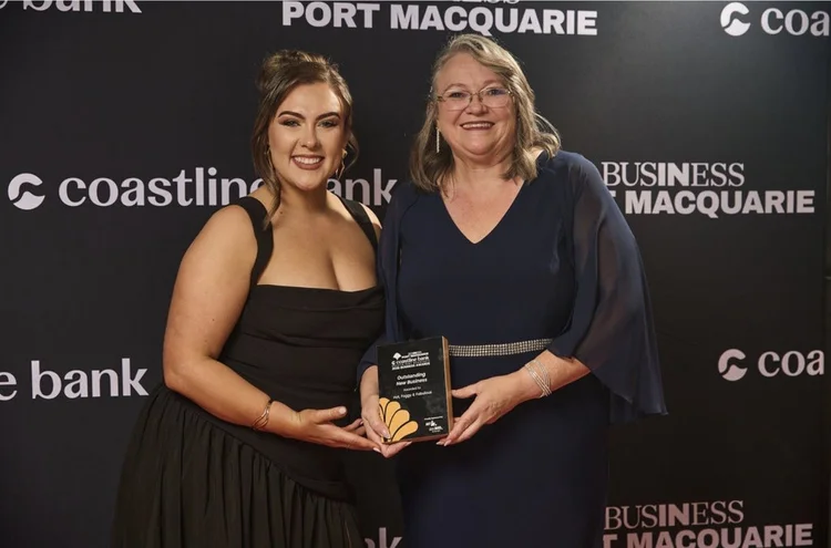 Susan receiving the Outstanding New Business award