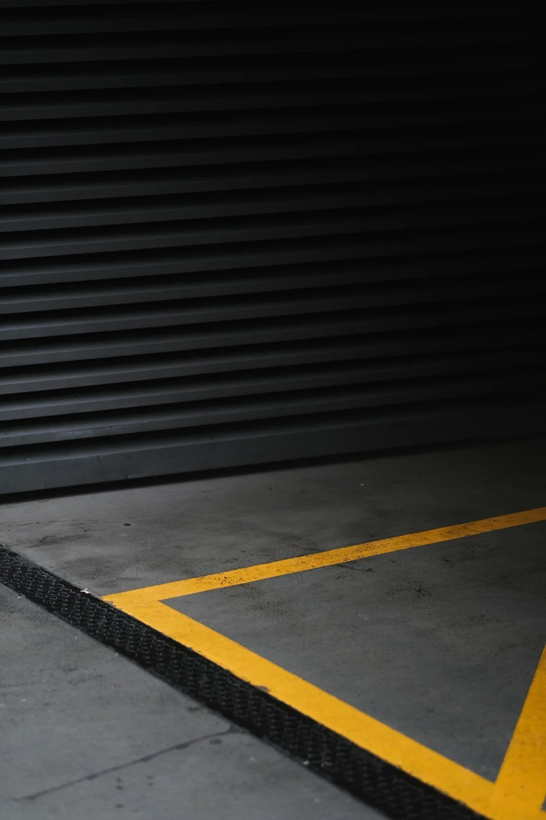 Forklift navigating aisles near industrial warehouse racking