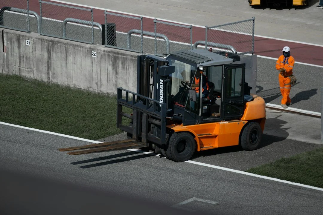 Forklift operating in a logistics warehouse highlighting daily inspection needs