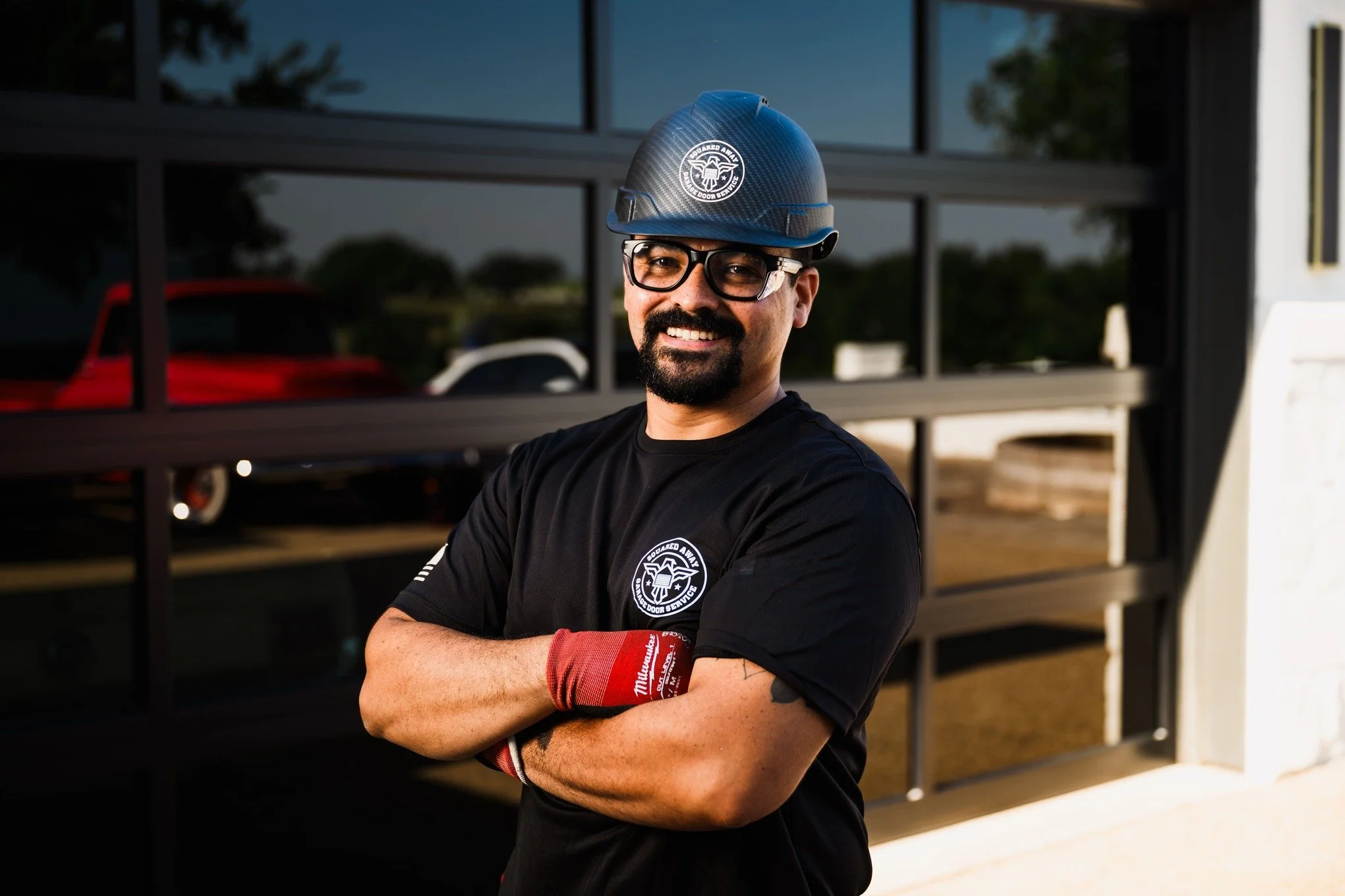 a technician on a late-night emergency garage door call at an established Brushy Creek home in Brushy Creek, TX by Squared Away Garage Door Service