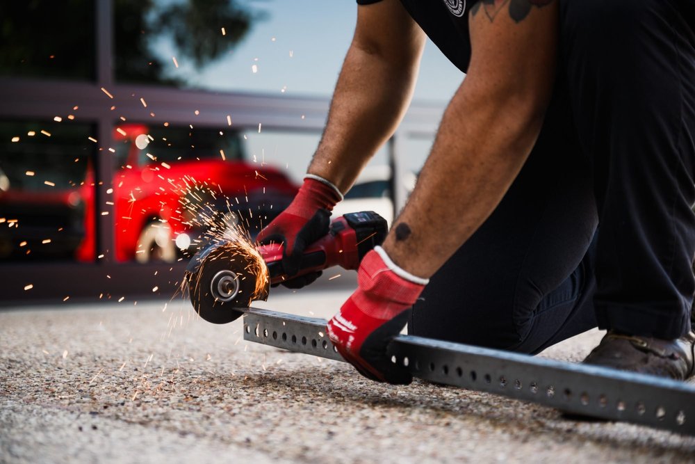 Squared Away technician diagnosing a garage door repair in Cedar Park, TX
