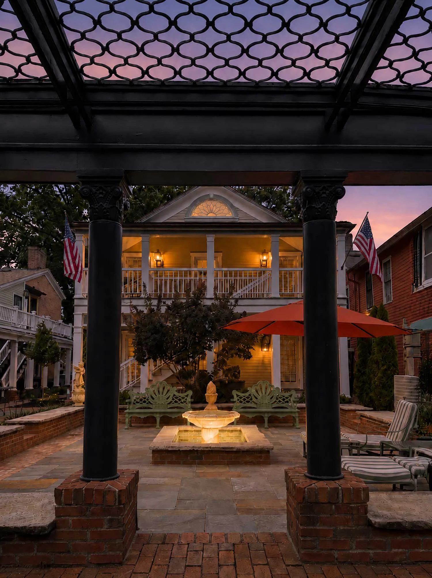 The illuminated courtyard and fountain at The Buxton Inn at twilight in Granville, Ohio.