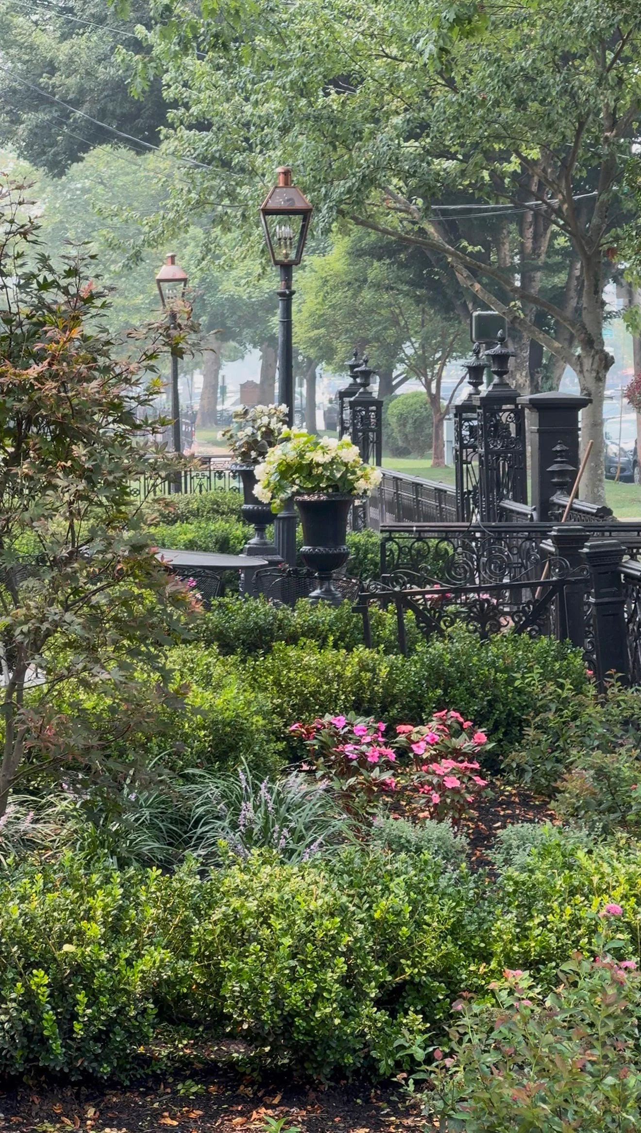 The Buxton Inn surrounded by summer greenery and flowers