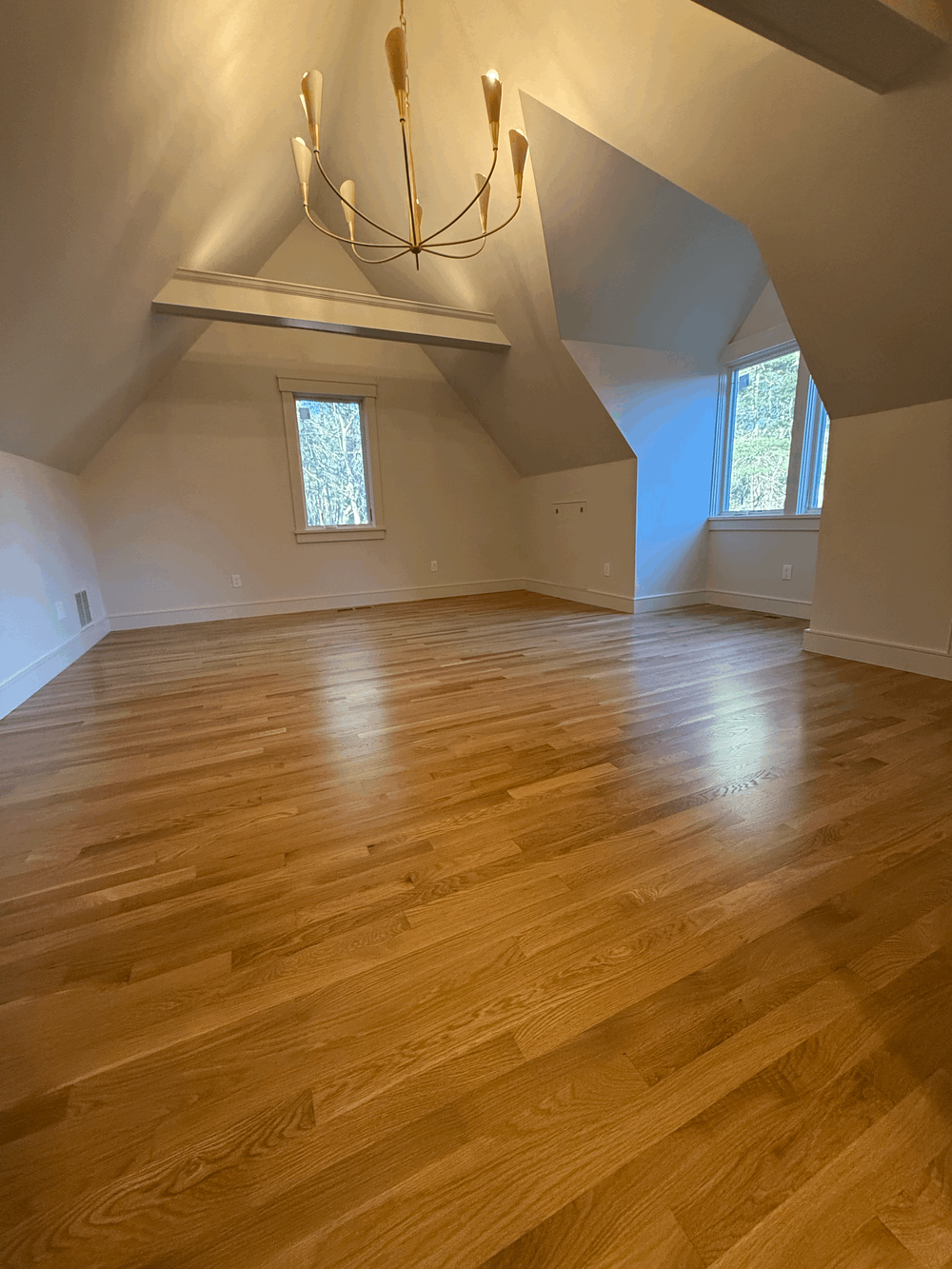 Hardwood floor refinishing project showing sanding and floor preparation