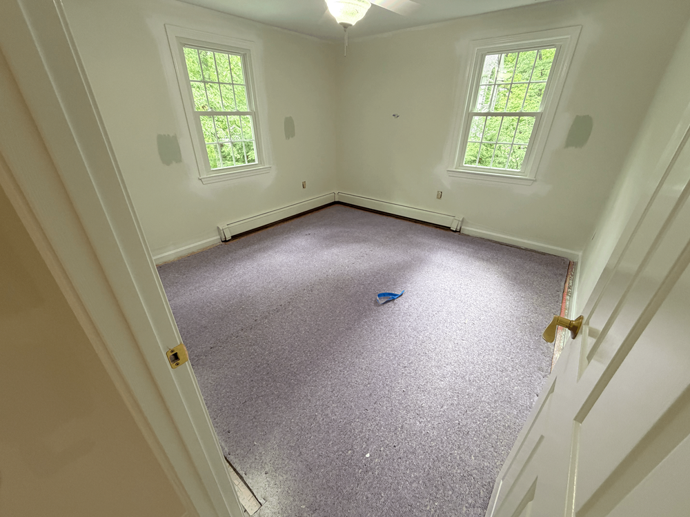 Andover second room with carpet before hardwood installation