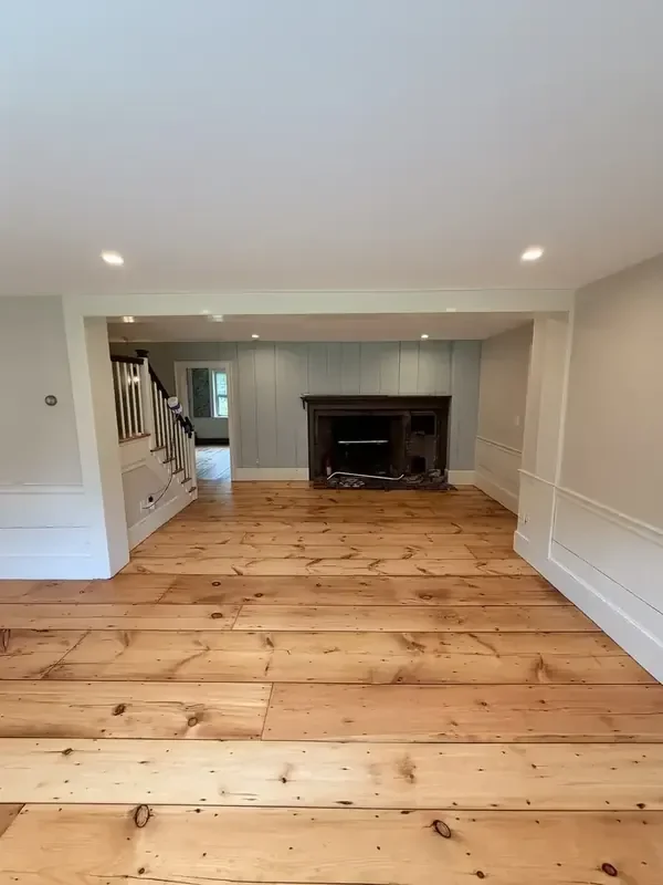 The same Weston fireplace room after sanding and satin finish