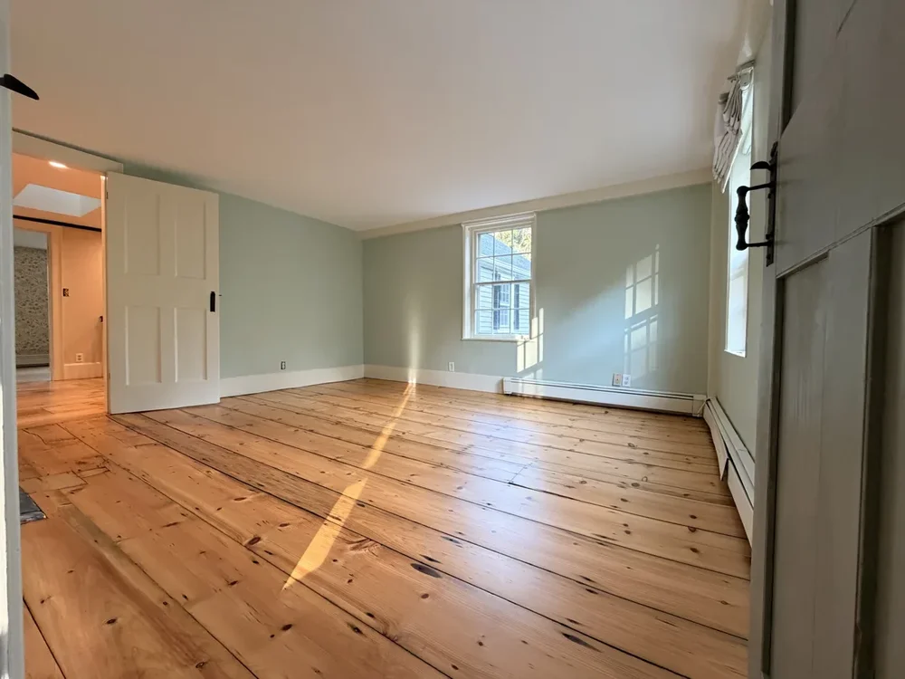 Green upstairs bedroom after refinishing