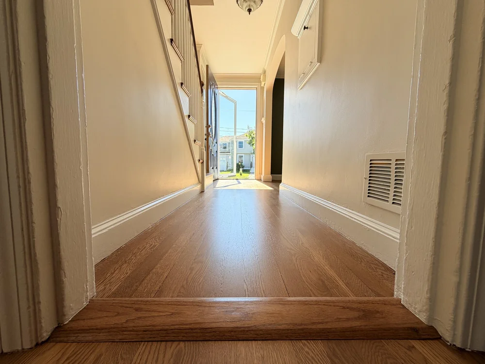 Refinished hallway floor and doorway transition