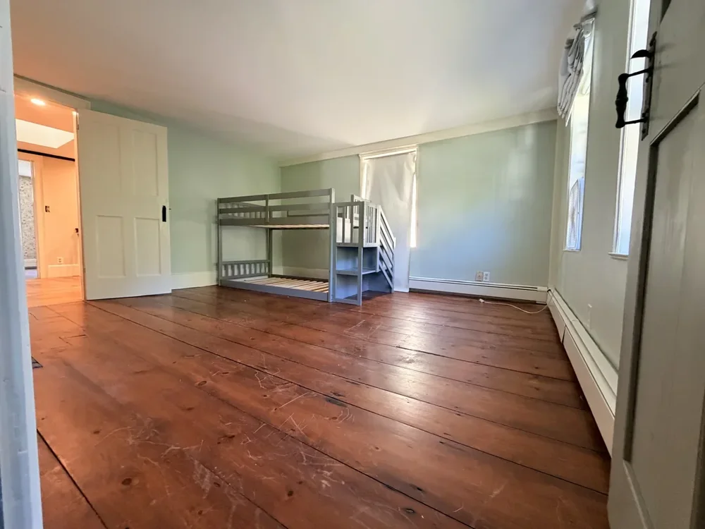 Green upstairs bedroom before refinishing