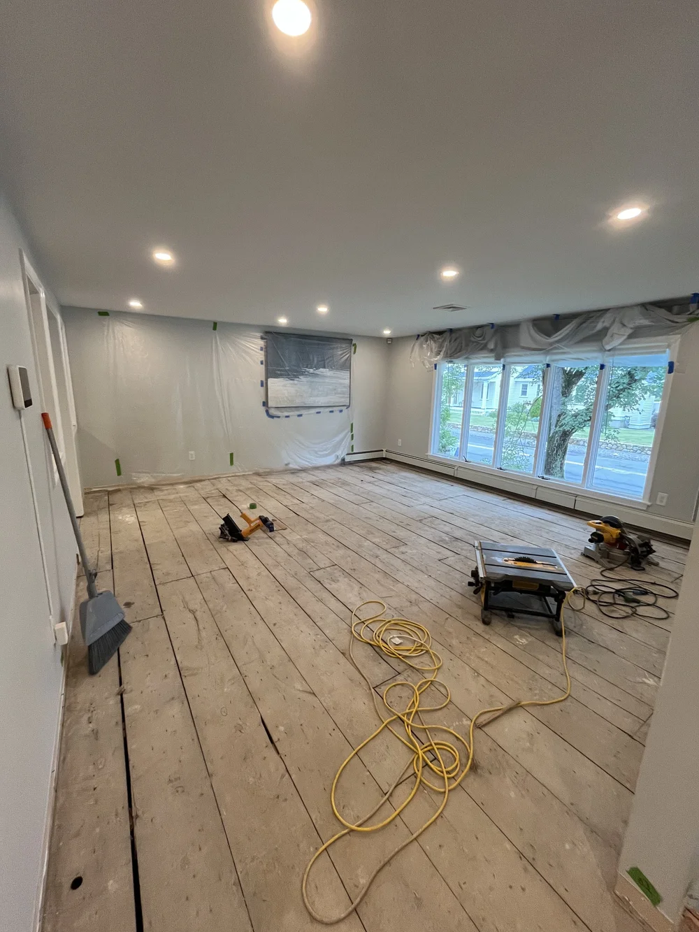 Subfloor being prepared before hardwood floor installation