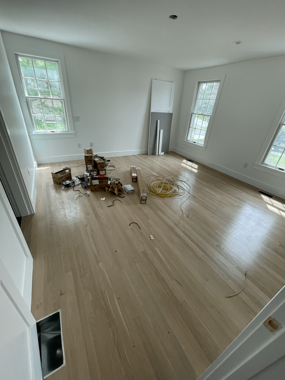 Hardwood floor refinishing work area prepared with professional equipment