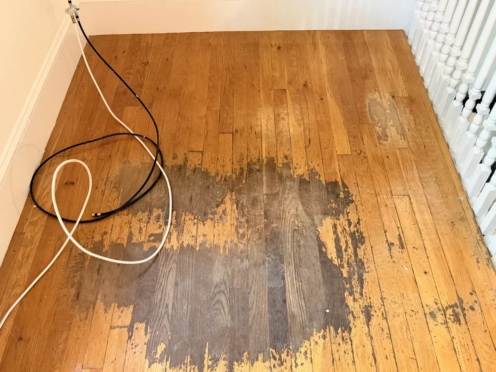 The stair landing before refinishing