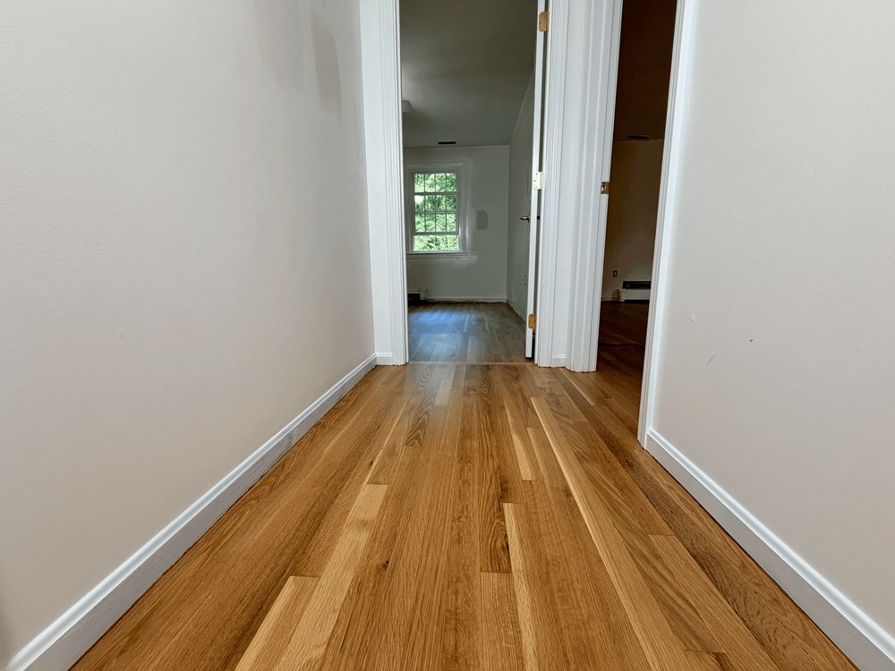 White oak board alignment through the Andover hallway