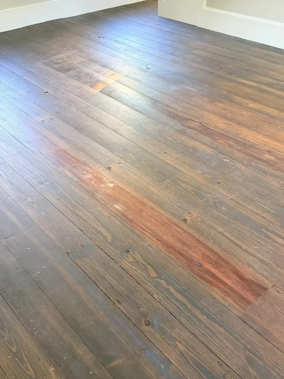 Same Weston wide-plank floor before refinishing