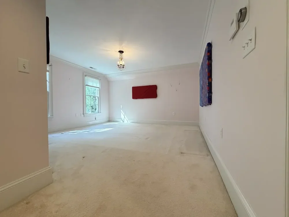 Wellesley bedroom with carpet before red oak installation