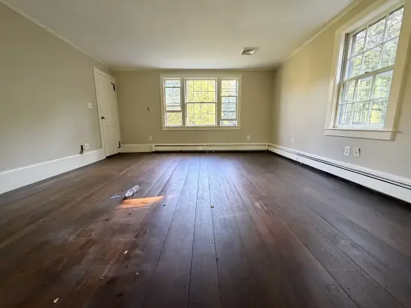 Weston historic upstairs wide-plank floor before refinishing