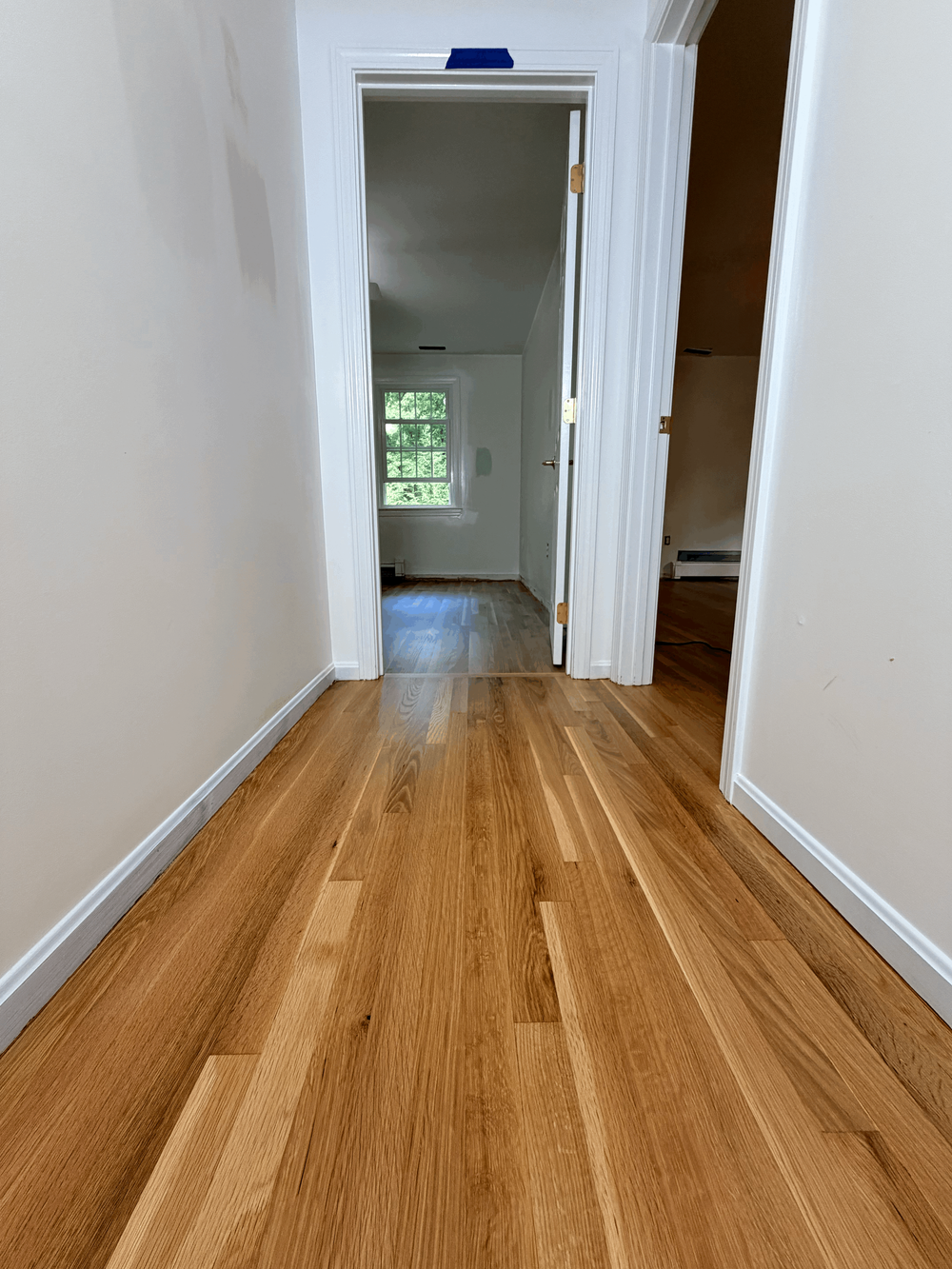 White oak installation aligned with the adjoining hallway