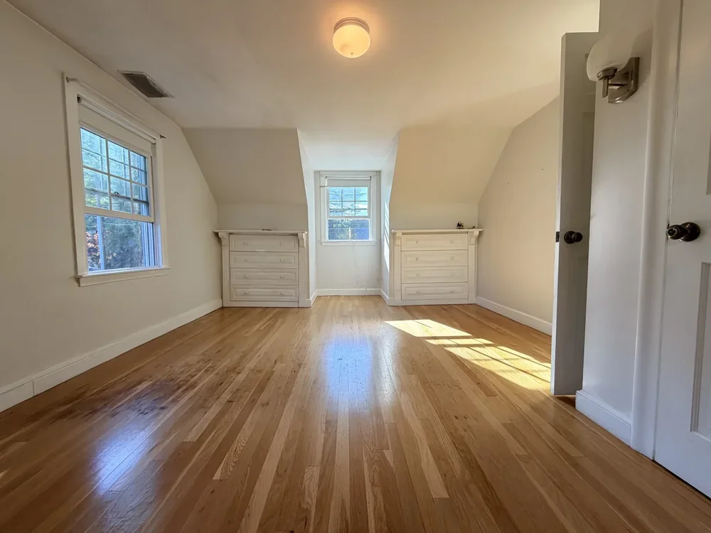 Upstairs room before hardwood floor sanding and refinishing in Concord